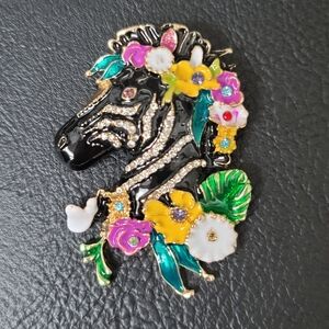 Colorful Zebra Brooch with Floral Accents